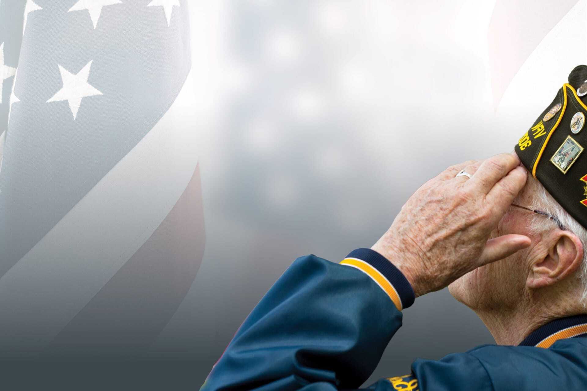 military veteran saluting the american flag